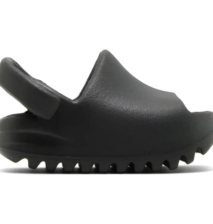Black platform sandal with chunky sole and slingback in Adidas Yeezy Slide Dark Onyx for infants