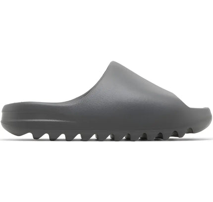 Gray Adidas Yeezy Slide Granite featuring a durable EVA foam ridged sole