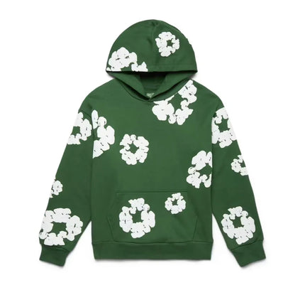 Green hoodie with white floral pattern from Denim Tears paired with low Dunks Nike or Jordan 4