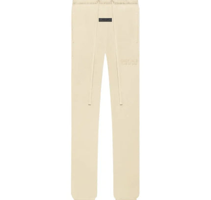 Cream-colored Fear of God Essentials Classic Sweatpant Shell with black brand tag