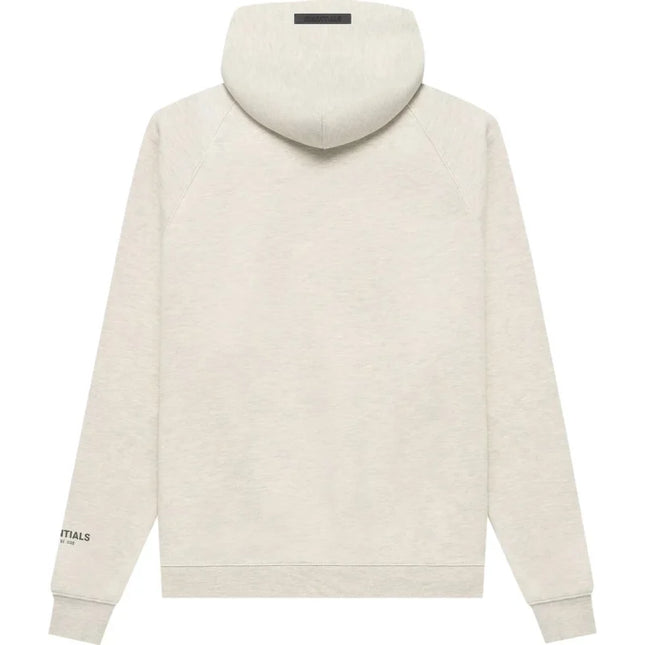 Cream-colored turtleneck sweatshirt in Fear of God Essentials Pullover Hoodie style