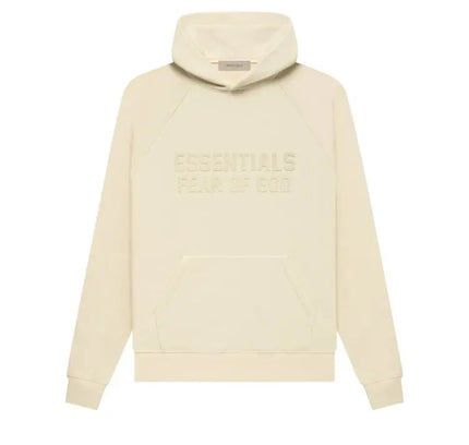 Cream-colored Fear of God Essentials Hoodie with embossed text on the front