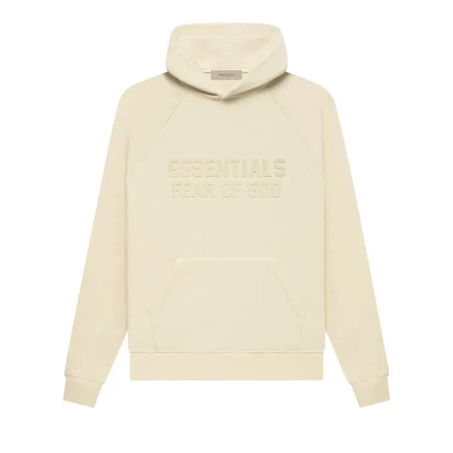 Cream-colored Fear of God Essentials Hoodie with embossed text on the front