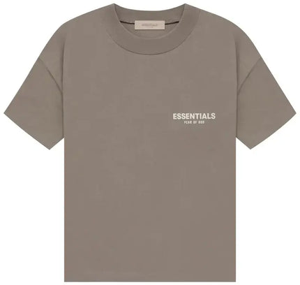 Taupe short-sleeved Fear of God Essentials T-shirt paired with Nike Dunk low dunks