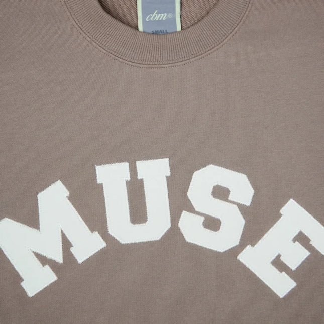 Tan French Terry Sweatshirt with MUSE in white letters on soft cotton fabric