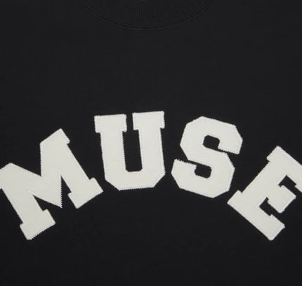 White text spelling MUSE on a French Terry Sweatshirt made of soft cotton fabric