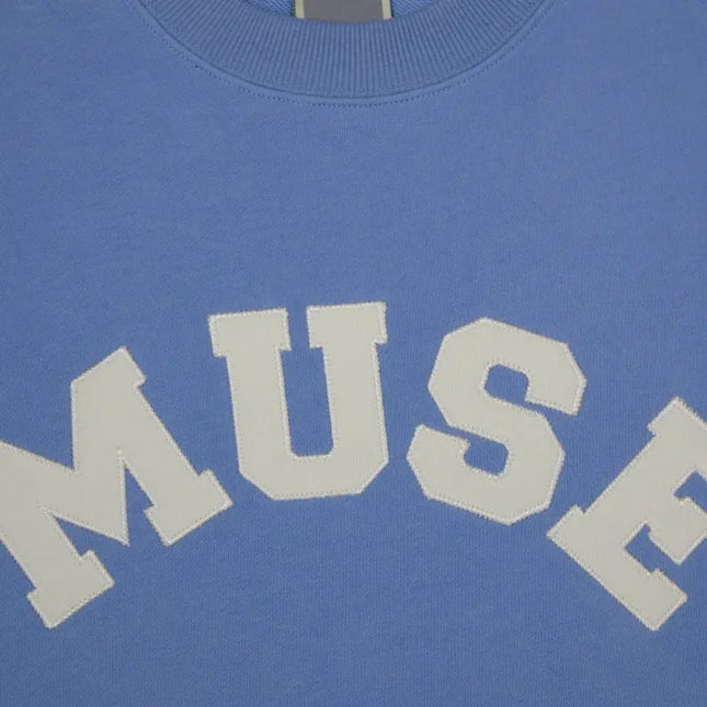 Light blue French Terry Sweatshirt with MUSE text in white cotton fabric