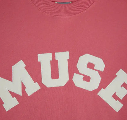 Pink French Terry Sweatshirt featuring white MUSE text on soft cotton fabric