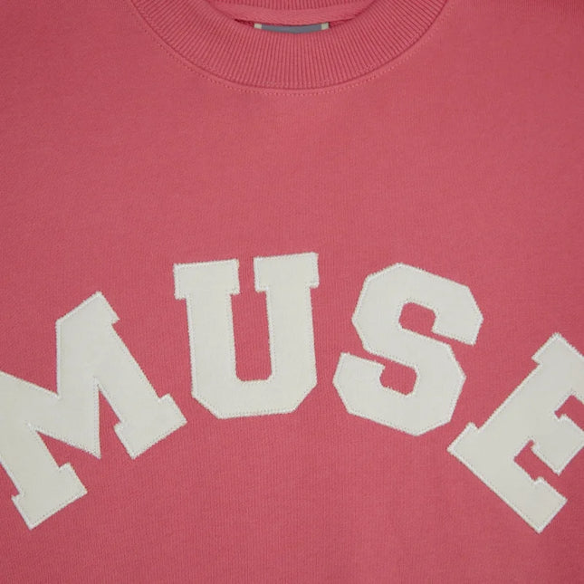 Pink French Terry Sweatshirt featuring white MUSE text on soft cotton fabric