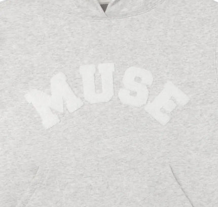 Light gray heavyweight chenille hoodie featuring MUSE text across the chest