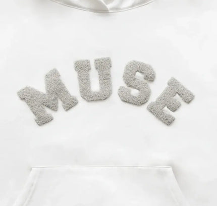 Heavyweight Chenille Hoodie in white with fuzzy gray MUSE lettering across the chest