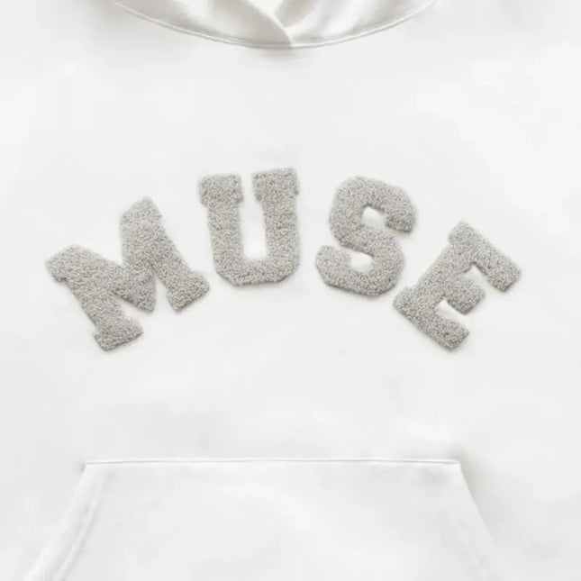 Heavyweight Chenille Hoodie in white with fuzzy gray MUSE lettering across the chest