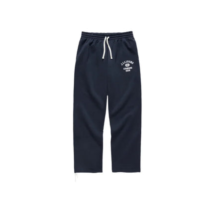 Navy blue JJJJound J80 Sweatpants feature a drawstring waist and printed logo