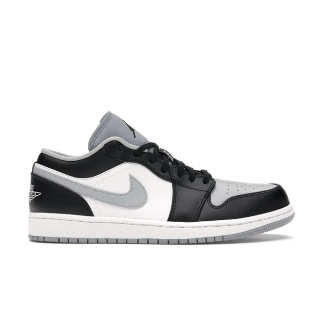 Air Jordan 1 Low Shadow sneaker featuring white leather base with black and grey colorway