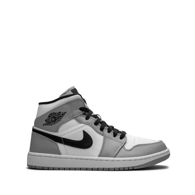 Air Jordan 1 Mid sneaker in smoke grey, white and black, a classic silhouette and neutral iteration