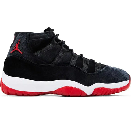 Women’s Air Jordan 11 Retro Bred Velvet features a classic black, white, and red colorway