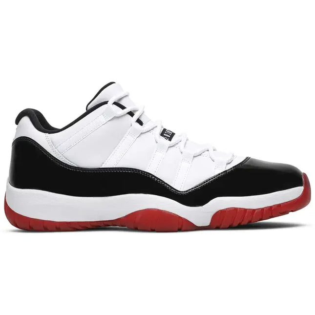 Classic Air Jordan 11 Low Concord Bred sneaker in white, black, and red colorway