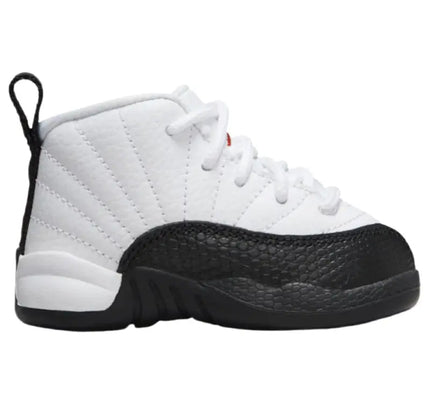 White and black Air Jordan 12 Retro Taxi Flip shoe with quilted leather upper