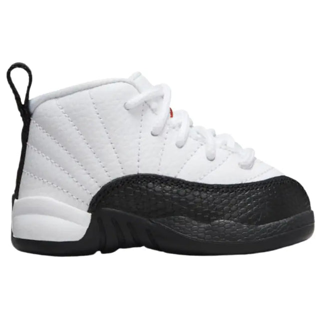 White and black Air Jordan 12 Retro Taxi Flip shoe with quilted leather upper