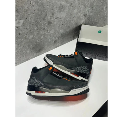 Pair of black and orange Air Jordan 3 sneakers from NO LID Jordan 3 Retro Fear Pack 2023