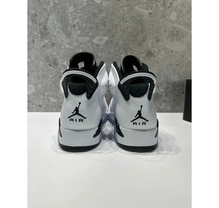 Pair of white and black Air Jordan sneakers from the NO LID Jordan 6 Retro Reverse Oreo collection
