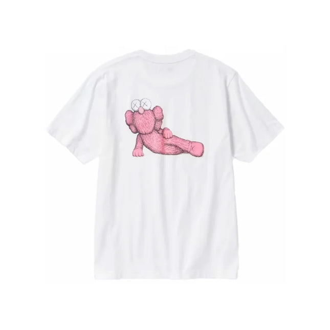 White T-shirt featuring a pink cartoon elephant design, KAWS x Uniqlo sleeve graphic pink