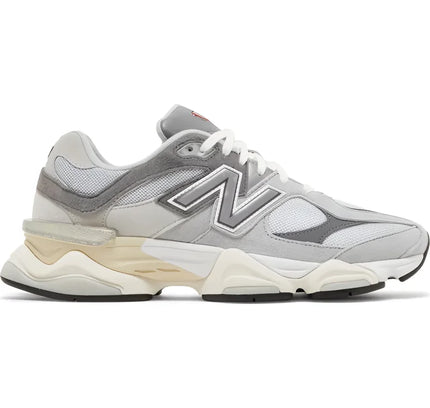 Grey and white New Balance 9060 Rain Cloud Grey sneaker with chunky sole and ventilated mesh