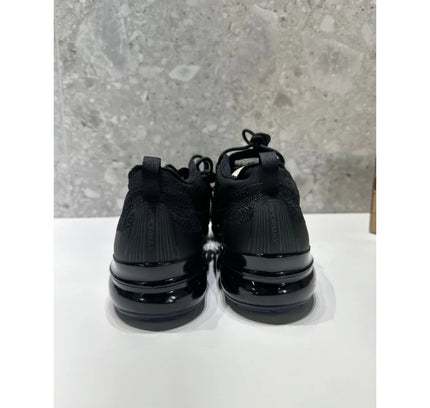 Pair of black Nike Air Vapormax athletic shoes for running and casual wear