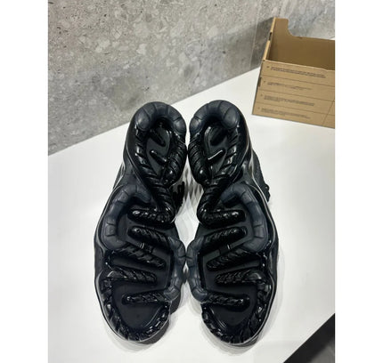 Black athletic shoe soles of Nike Air Vapormax 2023 Flyknit in Black Anthracite