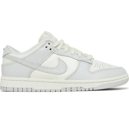 White Nike Dunk Low with light grey accents in Needlework Sail Aura design