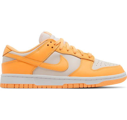 Nike Dunk Low in orange and light grey, featuring the low peach cream colorway