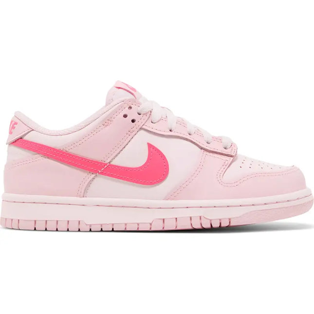 Pink and white Nike Dunk Low sneaker with coral swoosh for retro Nike basketball style