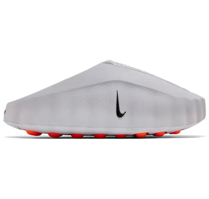 White nike mind 001 slide light smoke grey soccer cleat with black swoosh and bright orange studs for turf play