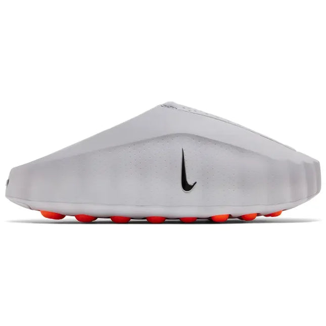 White nike mind 001 slide light smoke grey soccer cleat with black swoosh and bright orange studs for turf play