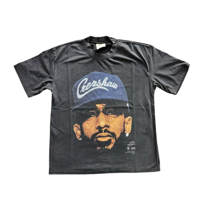 Dark gray Nipsey Big Face T-Shirt with artistic portrait and blue baseball cap design