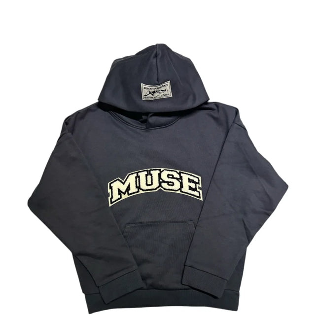 Black classic hoodie sweatshirt featuring MUSE text across the front in Chenille design