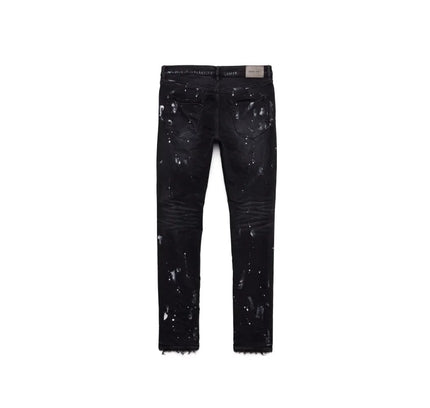 Black paint-splattered jeans with signature hang tag and resin knee slit details