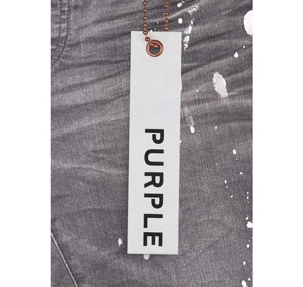 Gray denim jeans with a purple signature hang tag from P001 Worn Grey Knee Slit