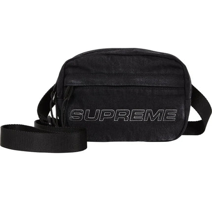 Black Supreme shoulder bag with embossed logo, zip pocket, textured finish, perfect for low dunks Nike style